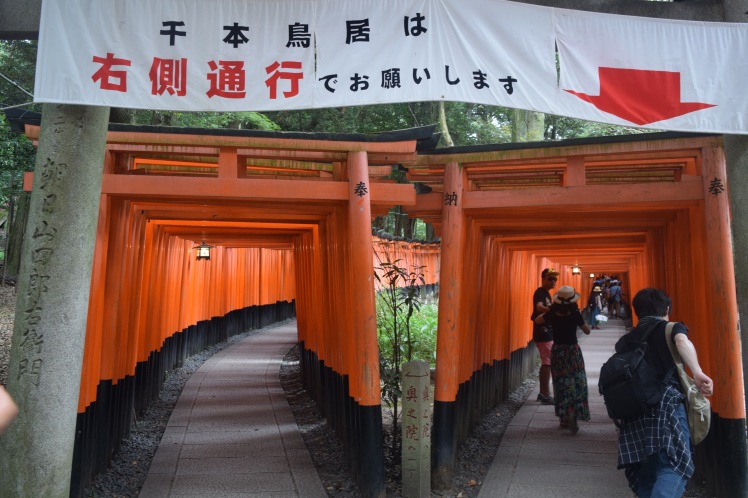 Visitors begin their trek through Fushimi Inari through the left tunnel of torii gates. | Photo by Alexandra Pamias