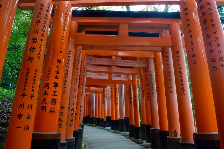 Most of the paths in Fushimi Inari Shrine are through tunnels of tall torii gates like these ones. | Photo by Alexandra Pamias